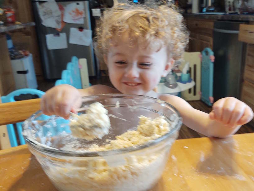 boy stirring dough