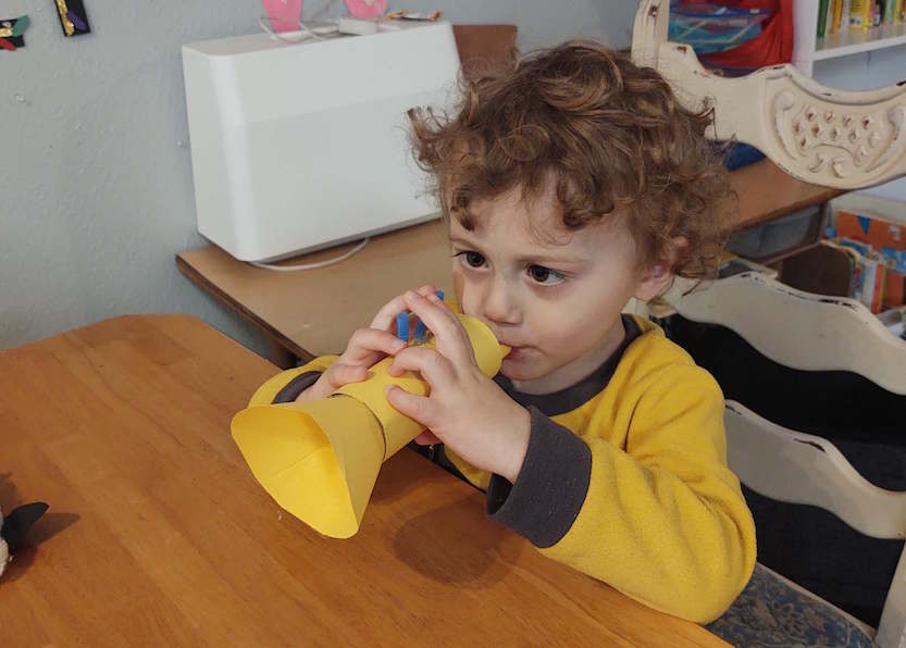 boy playing his trumpet craft